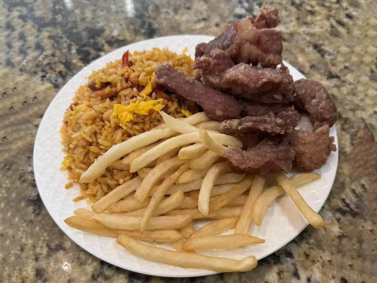 Crispy fried pork strips with rice and fries at Casa China, a Chinese Restaurant in Sanford
