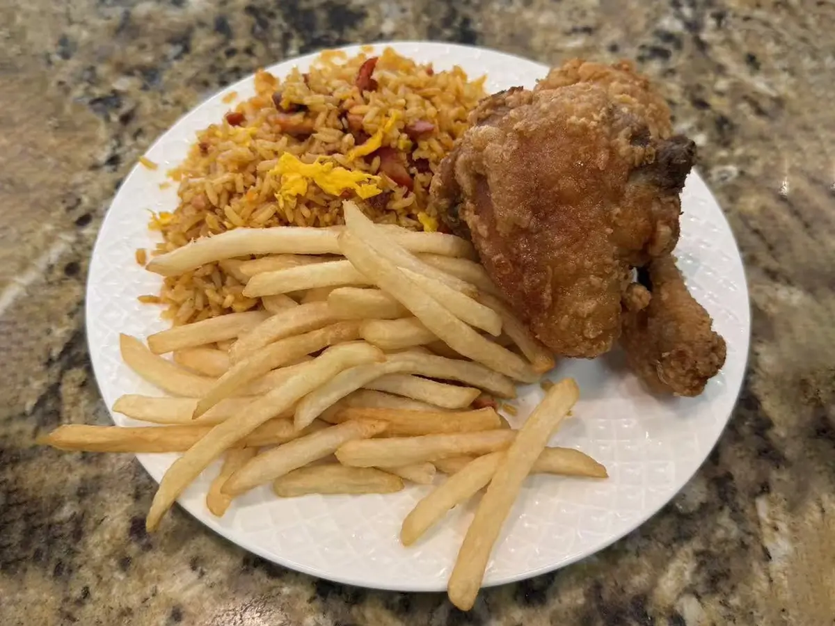 Fried chicken leg with rice and fries at Casa China, a Chinese Restaurant in Sanford