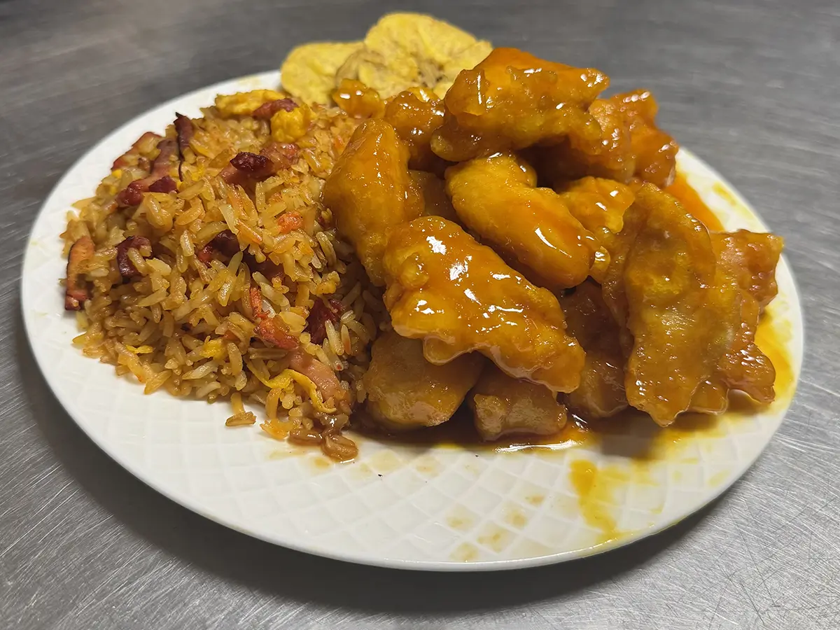 Orange chicken with rice and plantain chips at Casa China, a Chinese Restaurant in Sanford